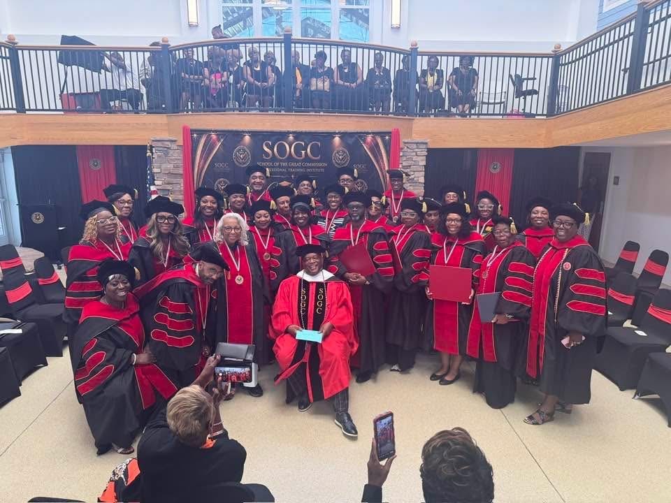 SOGC Class of 2026 graduation ceremony — Dr. Dion D. Banks with faculty and graduates in academic regalia